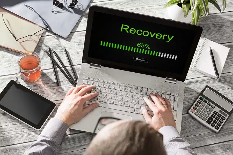 A computer downloading data after disaster recovery