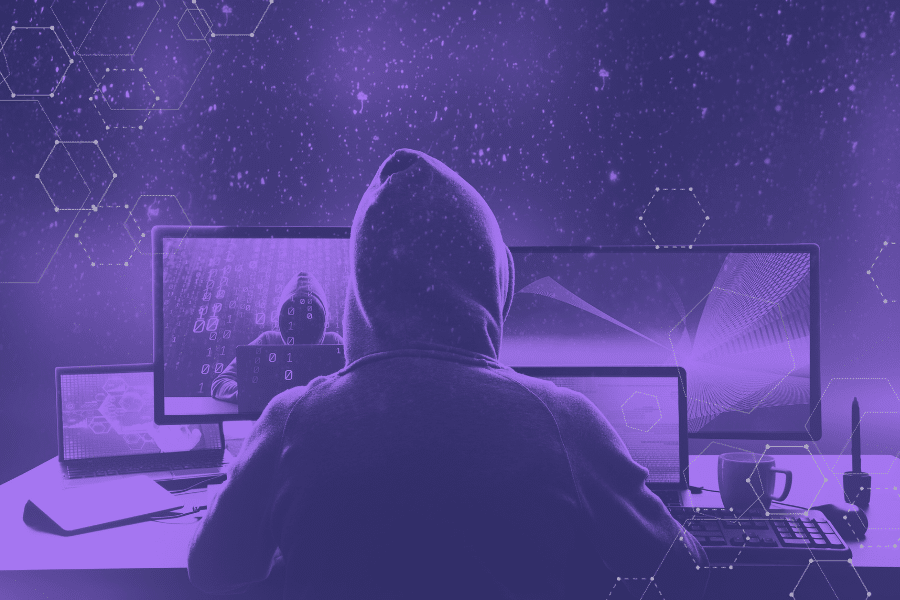 A hacker executing a phishing attack, illustrating potential threats to Single Sign-On (SSO) security, including credential theft and unauthorized access.